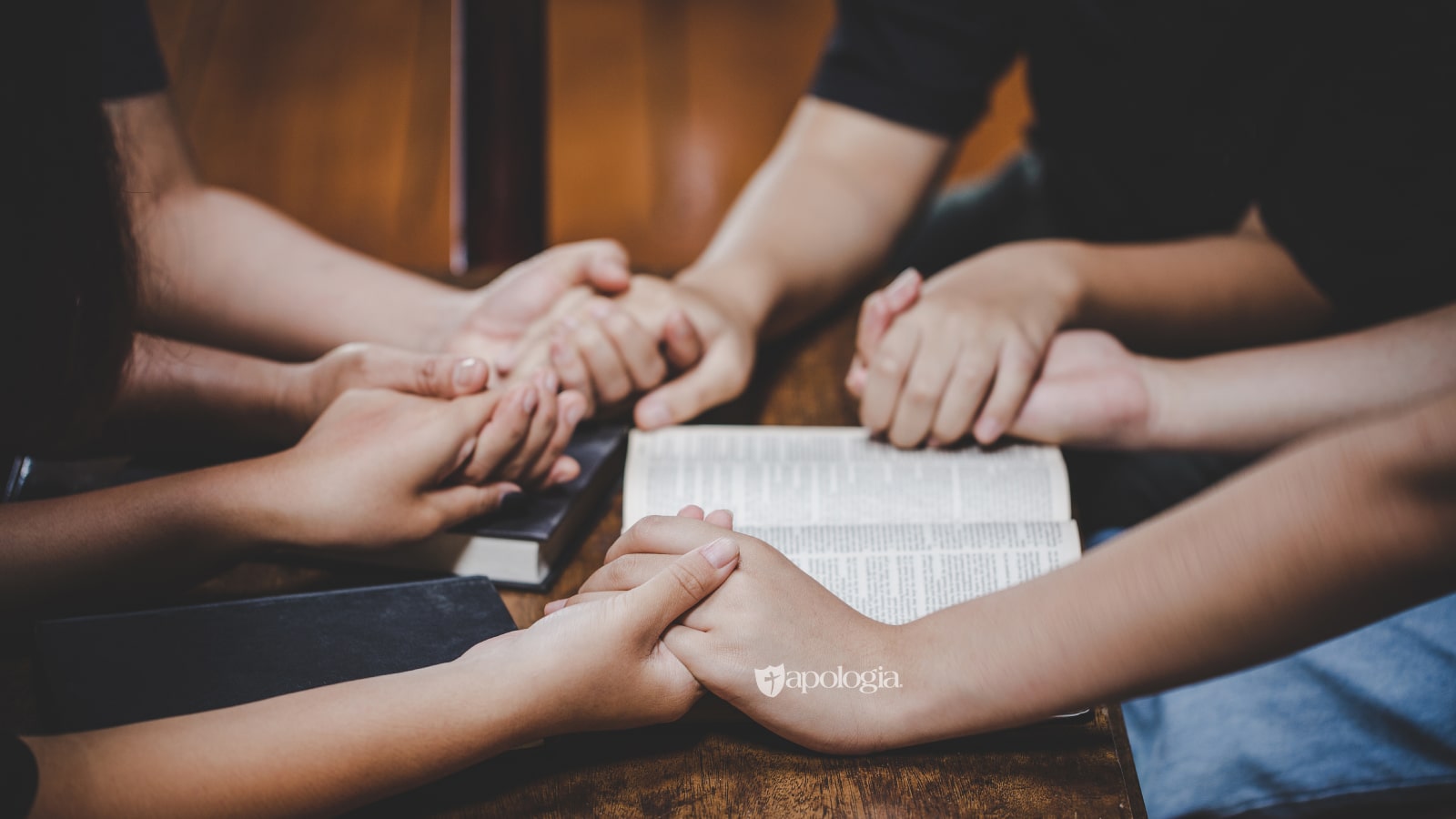 People holding hands in circle