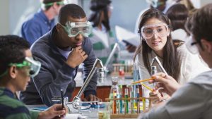 teens doing lab experiment