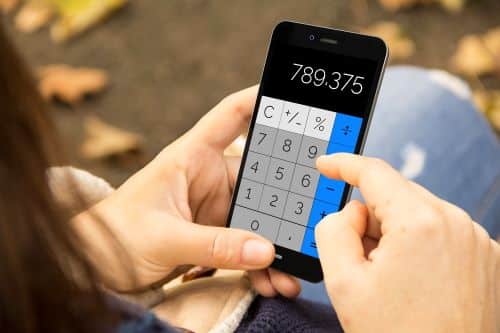 person using the calculator on their phone