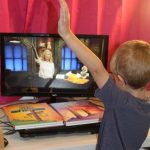 student doing hand motions with The Word in Motion Bible curriculum from Apologia
