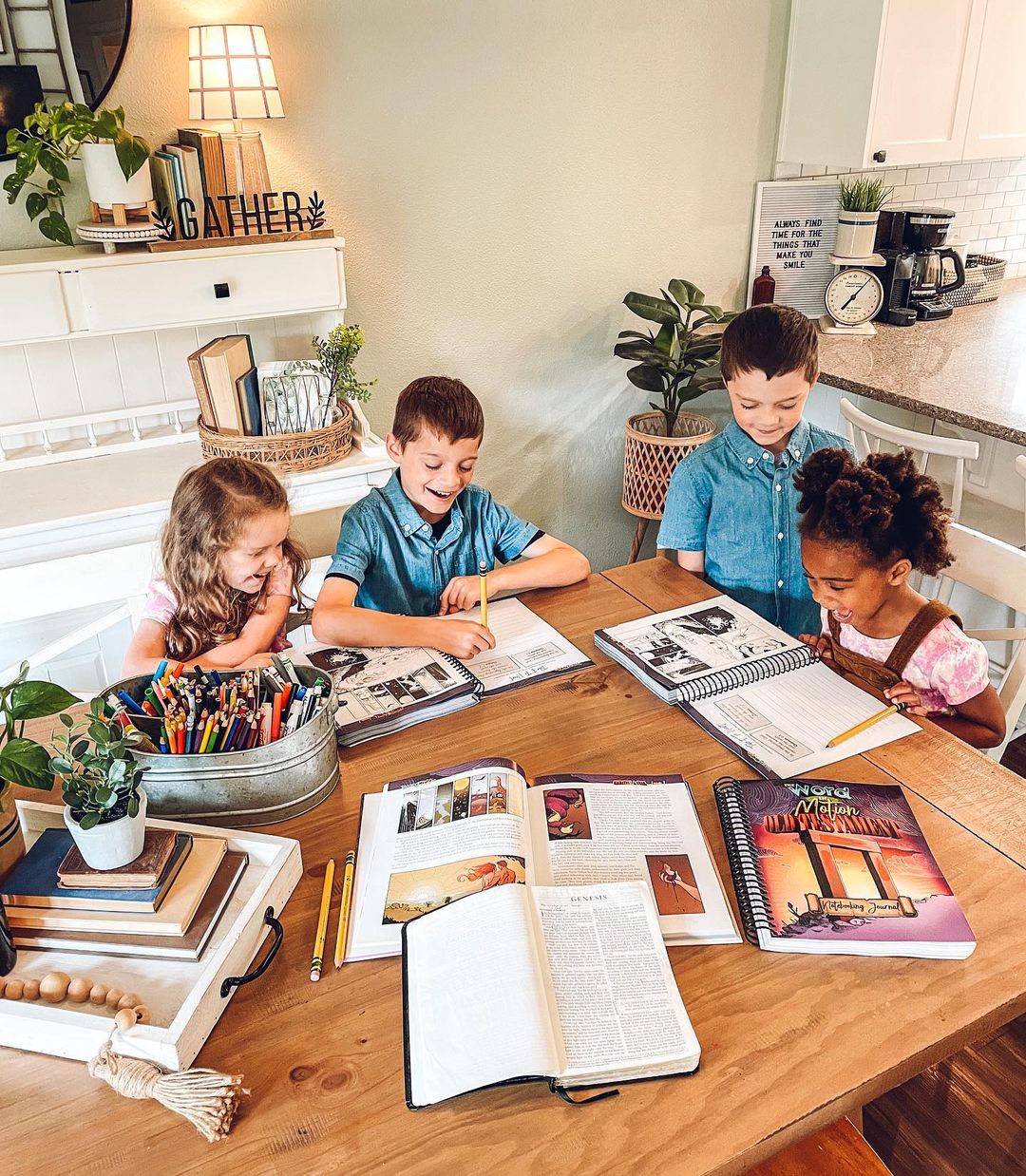 Four children working on The Word in Motion curriculum